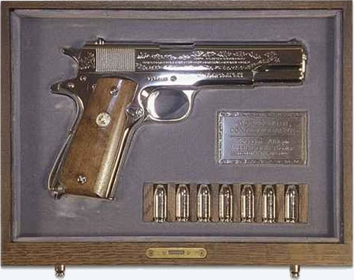 As indicated in his letter, Elvis presented Nixon with a gift. This was a commemorative World War II Colt 45 pistol in a wooden chest.